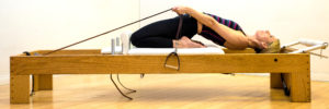 woman using pilates table