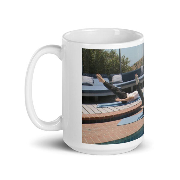 white glossy mug with people doing a pilates pose outdoors