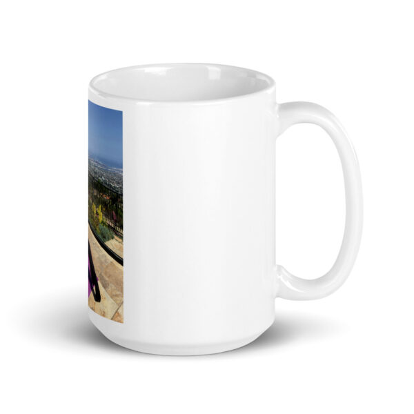 white glossy mug with photo of woman doing advanced pilates pose